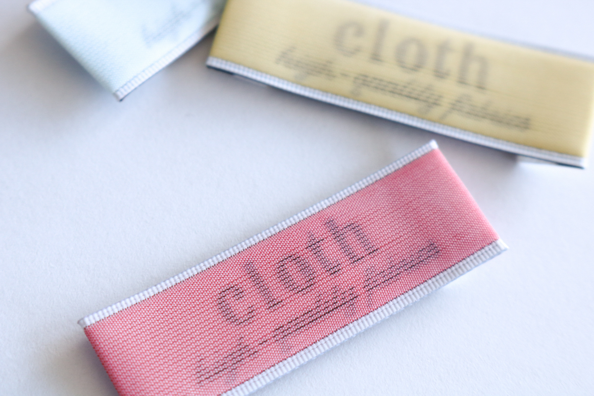 モノフィラ糸の袋織で文字スケスケ織ネーム（R7-5）cloth - 越前織の